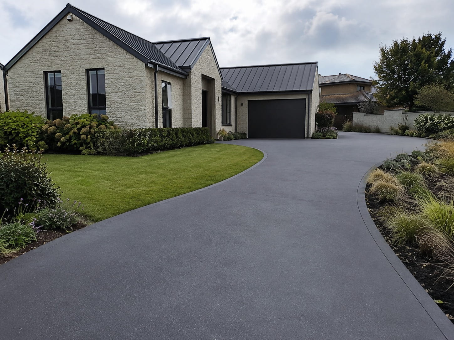 Coloured concrete driveway Auckland