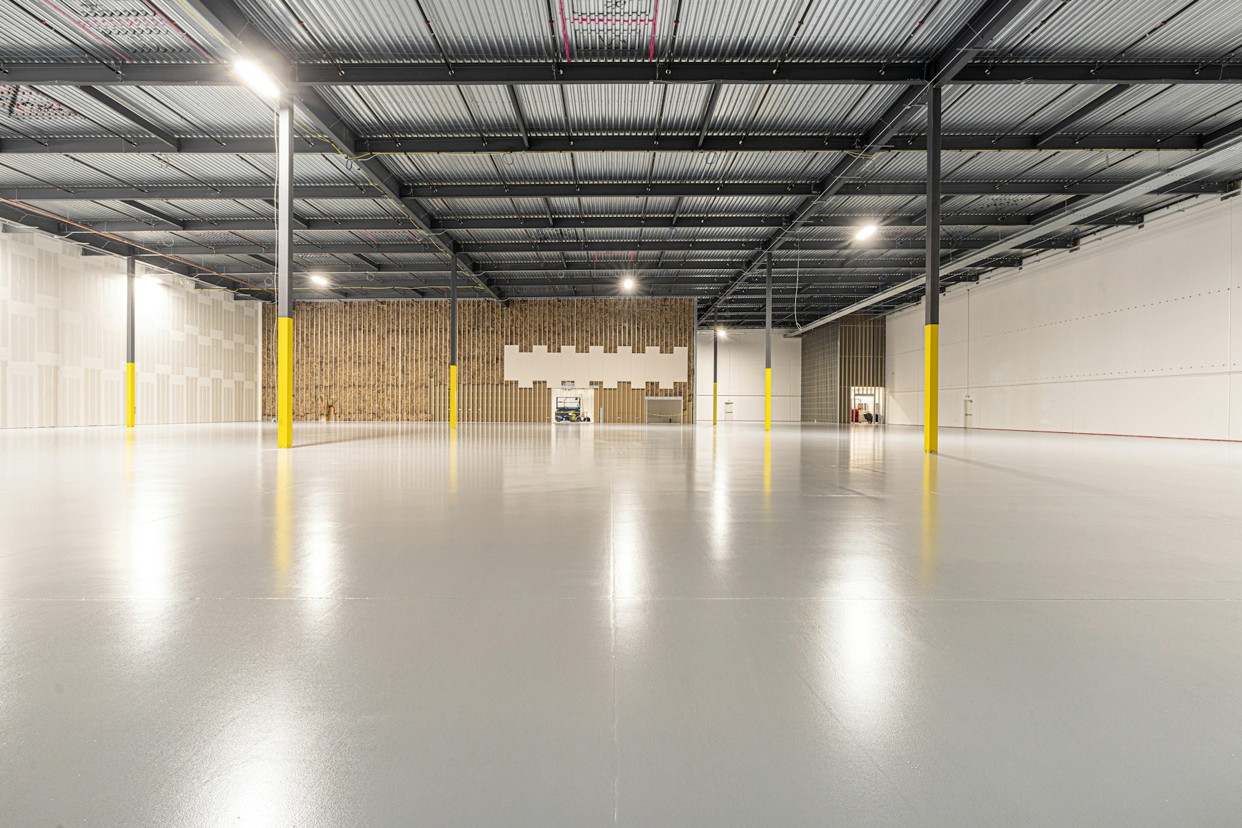 Clean sealed concrete floor surface in a practical workshop interior
