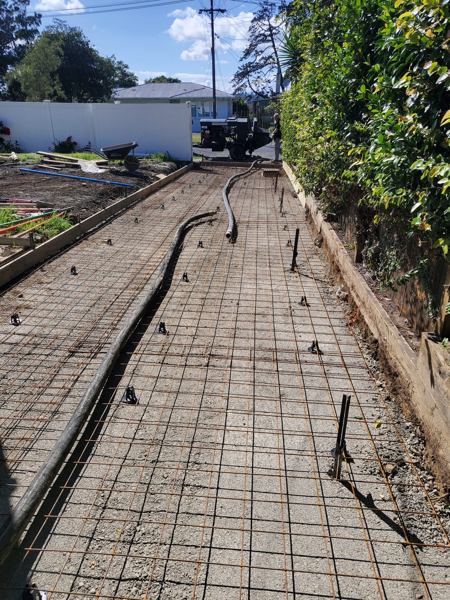 Concrete specialists levelling a driveway in Auckland