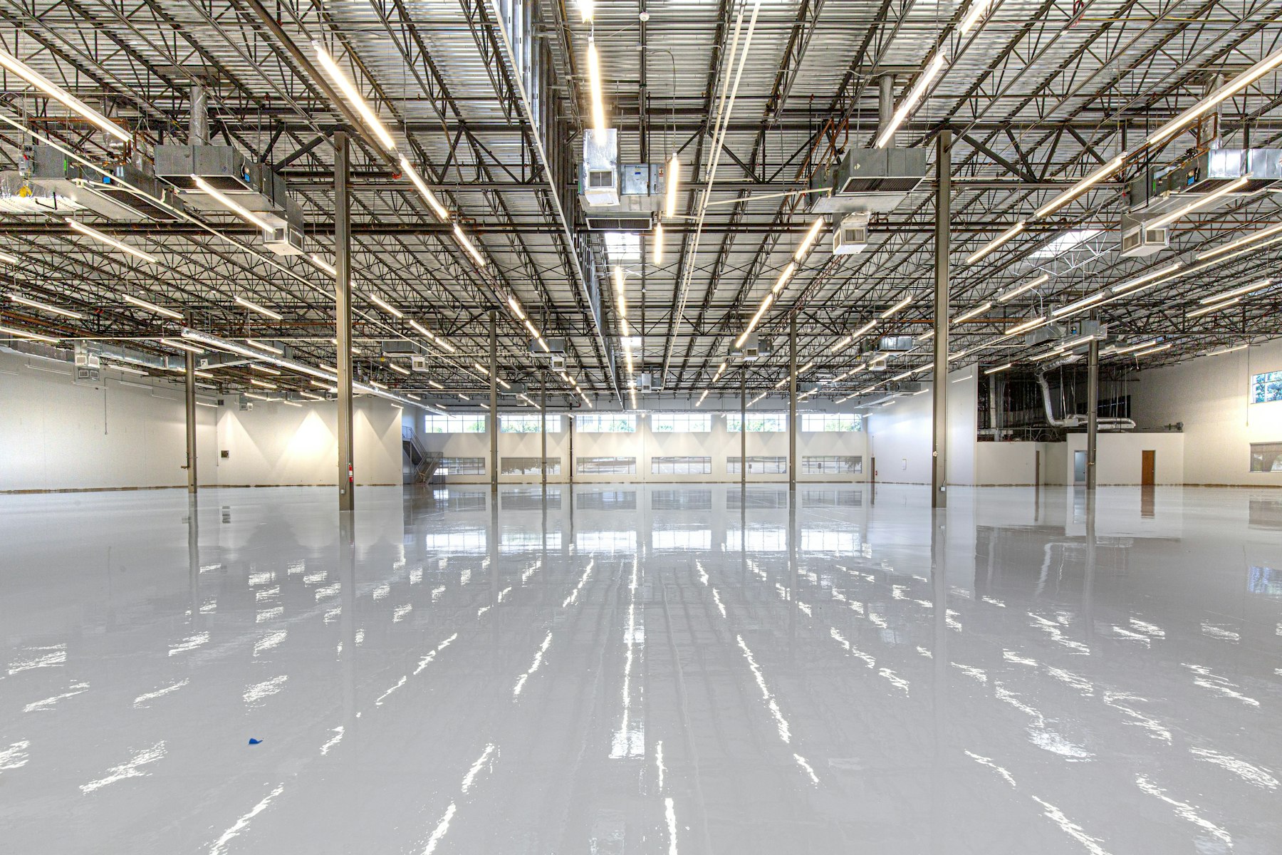 Reflective polished concrete floor in a clean commercial interior