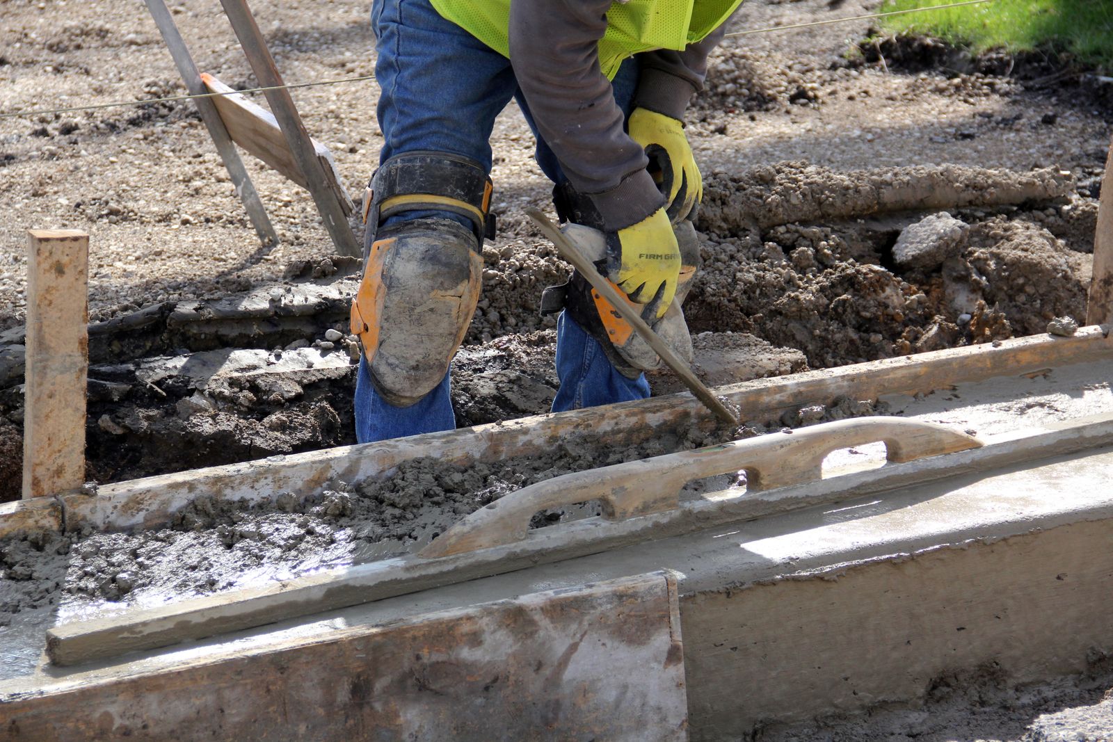 Contractor preparing and forming concrete for South Auckland driveway services